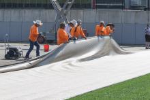 Workers utilize reclaimed Materials in field renovation